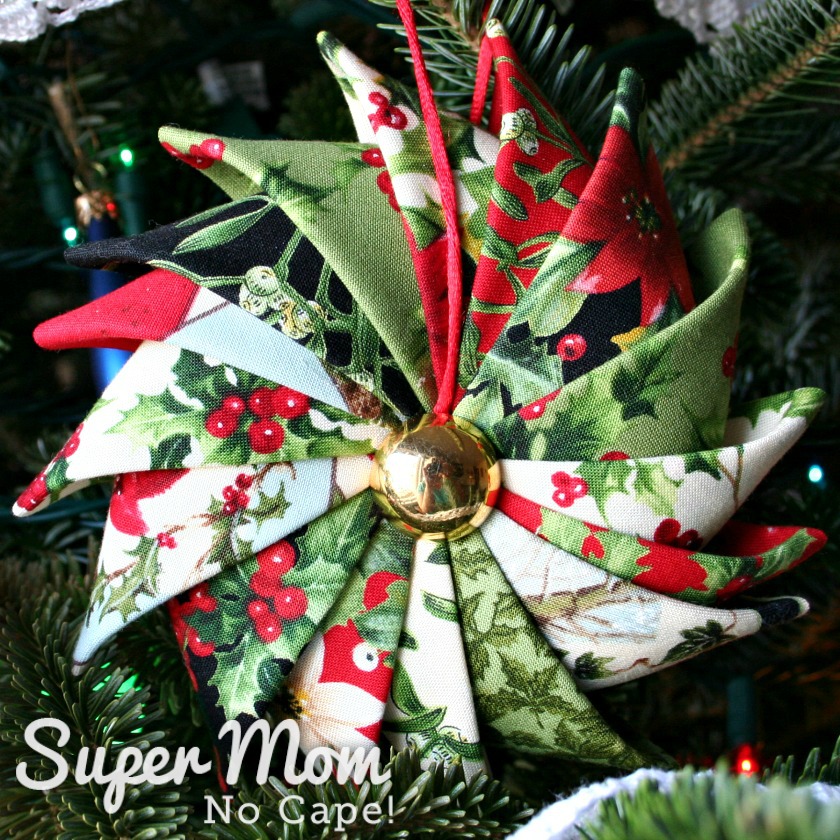Prairie Point Star Ornament made with 16 different Christmas fabrics