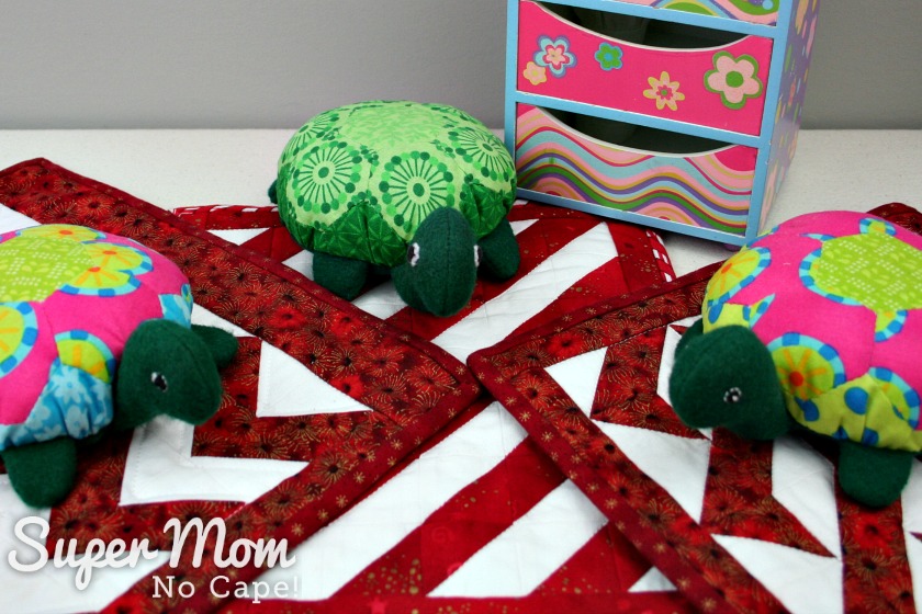 Lexie, Lanie and Rexie the Hexie Turtles sitting on their quilts