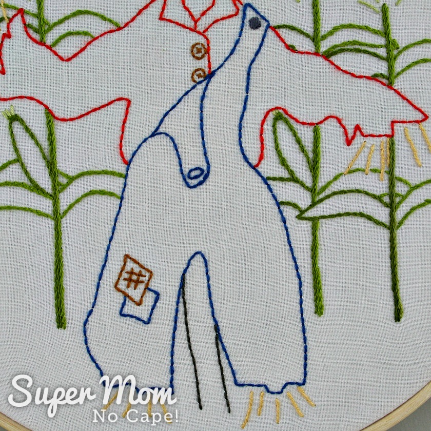 Blue overalls with patches embroidered for Strawbyn Scarecrow